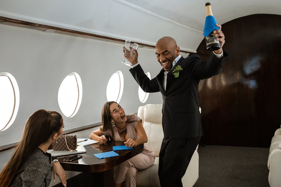 Passengers celebrating with champagne on private jet